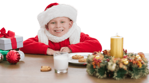 Smiling Boy with Santa Hat and Christmas Treats on Transparent