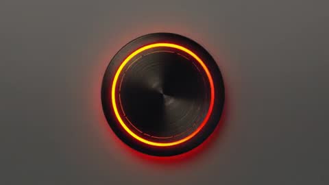 Rotary knob glowing amber LED ring rotating clockwise on brushed-metal control panel