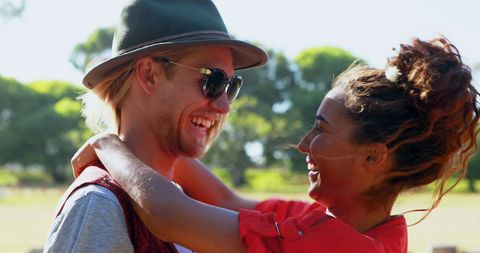 Smiling Hipster Couple Embracing at Vibrant Music Festival - Download Free Stock Images Pikwizard.com