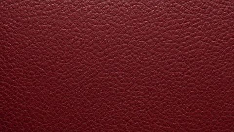 Burgundy pebbled leather texture seamless background for luxury design maroon closeup