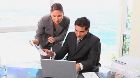 Colleague In Office Provides Collaborative Support During Work