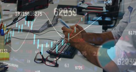 Successful Businessman Multitasking Stock Analysis on Smartphone