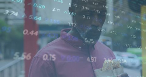 African American Professional Analyzing Virtual Stock Market Data