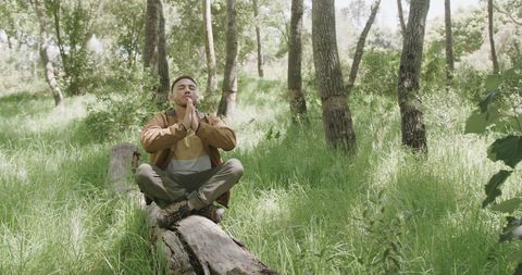 Man Meditating in Serene Forest