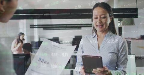 Business People Collaborating with Financial Data Overlay