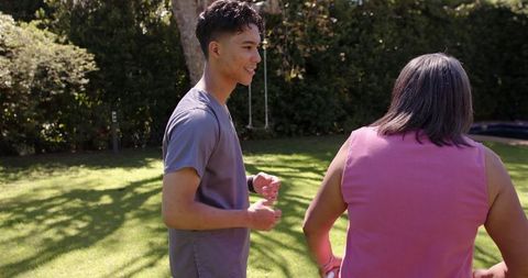 Physiotherapy Session Outdoors with Senior Woman and Young Therapist