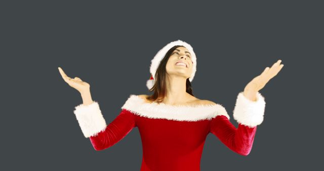 Joyful Woman Wearing Santa Outfit Celebrating Christmas - Download Free Stock Images Pikwizard.com