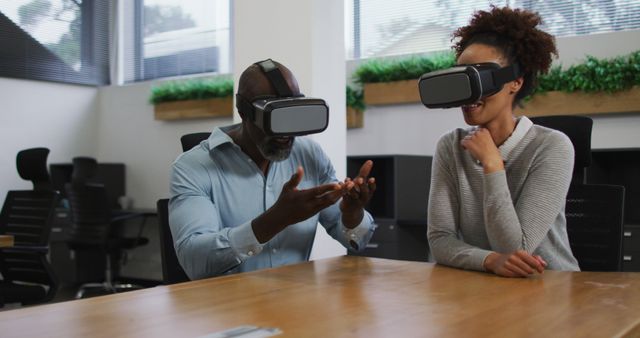 Colleagues Using Virtual Reality Headsets Exploring VR in Modern Office - Download Free Stock Images Pikwizard.com