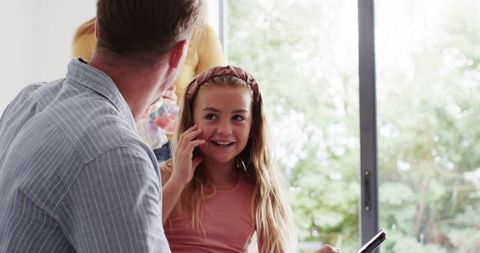 Family Packing Together for Summer Vacation at Home
