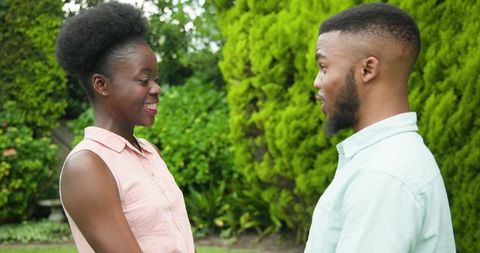 Romantic outdoor proposal with surprised joyful reaction