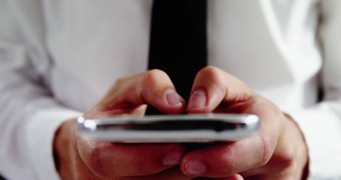Businessman Engaged in Smartphone Communication - Download Free Stock Images Pikwizard.com