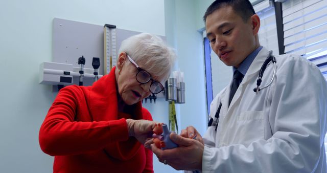 Elderly Patient Receiving Medical Guidance from Doctor in Clinic - Download Free Stock Images Pikwizard.com