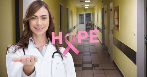 Female Doctor Supporting Breast Cancer Awareness in Hospital Corridor