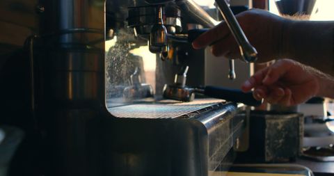 Barista Brewing Espresso at Cafe
