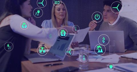 Business team collaborating on sustainable energy strategy with digital icon overlay