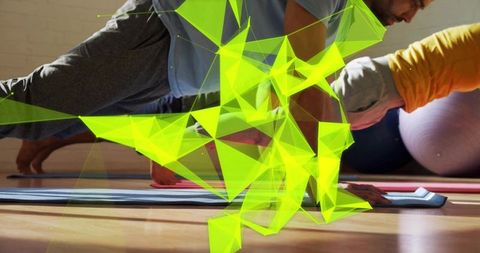 Duo holding plank with neon geometric overlay in sunlit fitness studio
