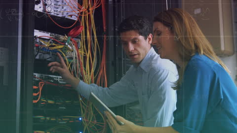 Two IT Technicians Managing Data Servers and Networks