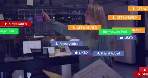 Manager tapping tablet marking glass board with floating notifications and kpi planning
