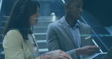 Diverse Professionals Analyzing Digital Data Insights in Modern Office