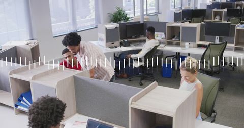 Diverse Coworkers Collaborating with Overlaid Graph Graphic in Modern Office - Download Free Stock Images Pikwizard.com
