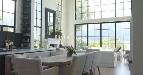 Sunlit Scandinavian Farmhouse Dining Room with Live-Edge Timber Table and Grid Windows