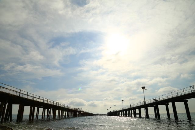 Sublime Ocean View at Sunrise with Pier Silhouettes - Download Free Stock Images Pikwizard.com