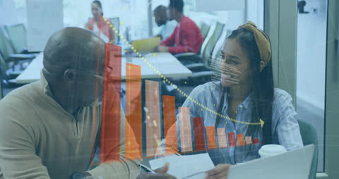 Team Discussing Business Growth with Digital Graph Overlay