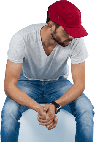 Caucasian Man with Red Hat Sitting on Transparent Background - Download Free Stock Videos Pikwizard.com