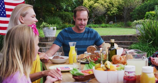 Family Enjoying Outdoor Picnic with American Flag as Decor - Download Free Stock Images Pikwizard.com