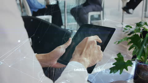 Businessman Utilizing Tablet for Data Analysis and Strategy