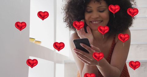 Smiling Woman Engaging with Social Media using Smartphone