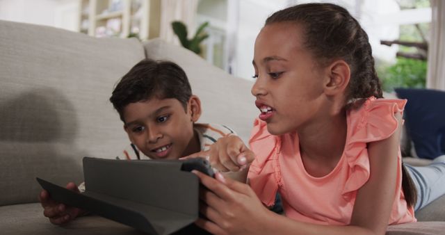 Children Using Tablet Together on Living Room Sofa - Download Free Stock Images Pikwizard.com