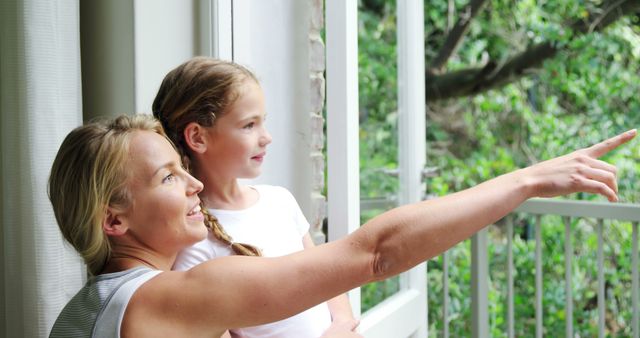 Happy Mother and Daughter Looking Out Window Enjoying Nature - Download Free Stock Images Pikwizard.com