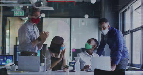 Office Team Applauding While Wearing Masks During Pandemic