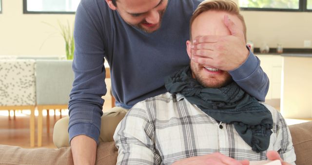 Man Surprising His Friend by Covering Eyes at Home - Download Free Stock Images Pikwizard.com