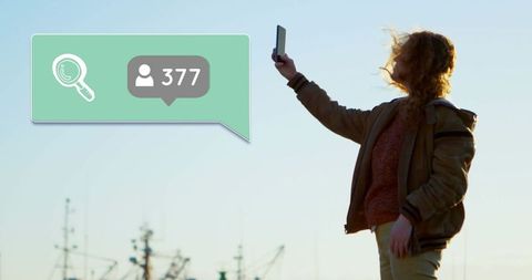 Woman taking selfie with global social media connections concept