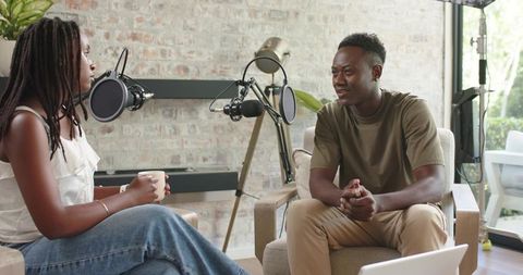 Black Co-hosts Recording Casual Podcast Interview in Cozy Home Studio