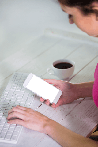 transparent display: woman multitasking with phone and keyboard - Download Free Stock Videos Pikwizard.com
