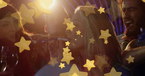 Friends Celebrating Holiday Party with Golden Stars Overlay