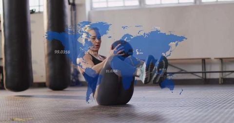 Sporty Woman Performing Core Rotations in Industrial Gym Setting