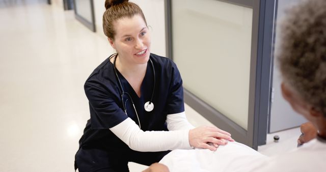 Nurse Comforting Elderly Patient in Hospital Corridor - Download Free Stock Images Pikwizard.com