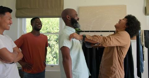 Friends Laughing Together Before Wedding Celebration