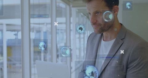 Business Professional Typing on Laptop with Futuristic Digital Interface