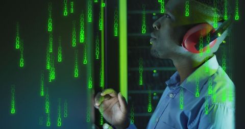 IT Engineer Wearing Headphones with Binary Code Overlay - Download Free Stock Images Pikwizard.com