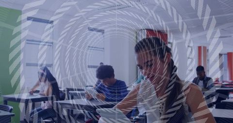 Female student using tablet and writing in classroom with chevron overlay for e-learning