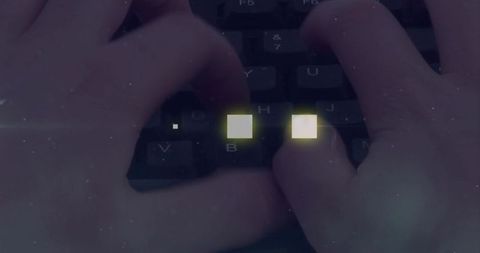 Typing hands pressing keyboard with glowing digital squares in grainy low-light workspace