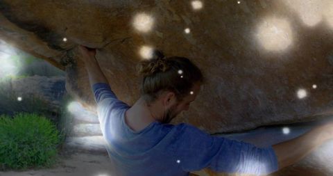 Athletic Male Rock Climber on Sunlit Boulder Adventure Outdoors