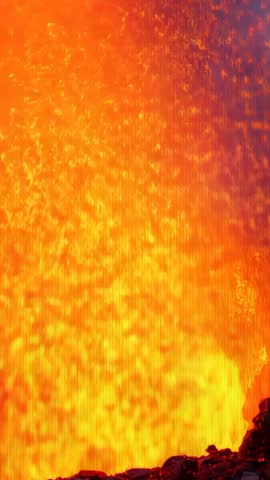 Vertical video showing lava fountain erupting, pressure driving steam plume