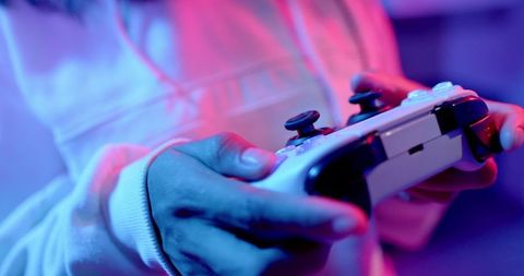 Hands-on console gaming experience with bright neon lighting