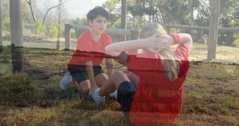 Kids Performing Sit-ups Outdoors in Park